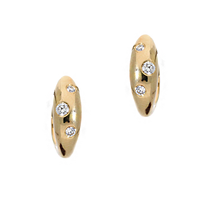 Gold hoop earrings with embedded diamonds on a white background