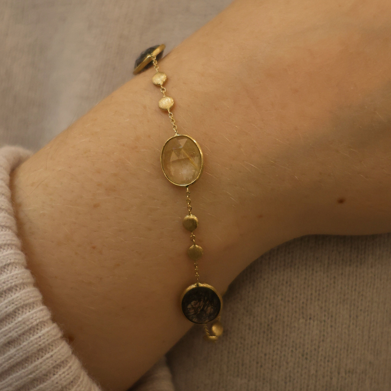 14ct gold quartz bracelet featuring a polished gold band and a central quartz gemstone, elegant jewelry piece from Appleby Jewellers Dublin