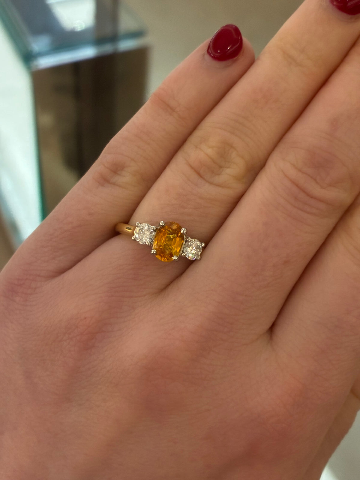 Tangerine Sapphire diamond ring by Appleby Jewellers Dublin featuring a vibrant orange sapphire set in a sleek gold band.