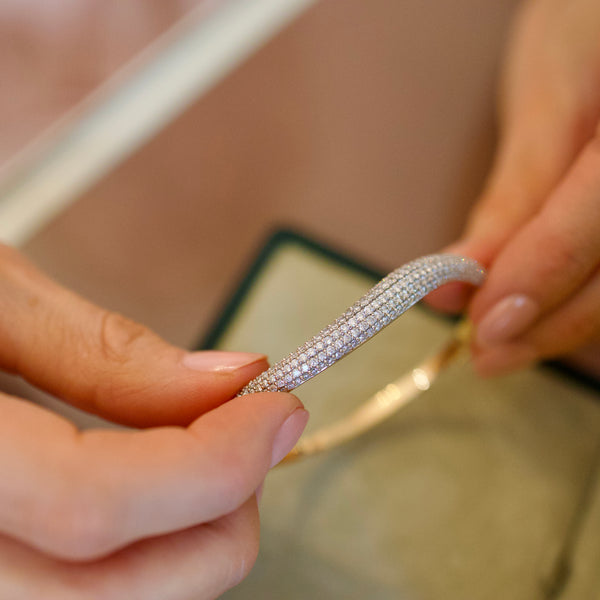 Elegant Wave Diamond Bangle by Appleby Jewellers Dublin showcasing a sleek design with sparkling diamonds on a polished bracelet.