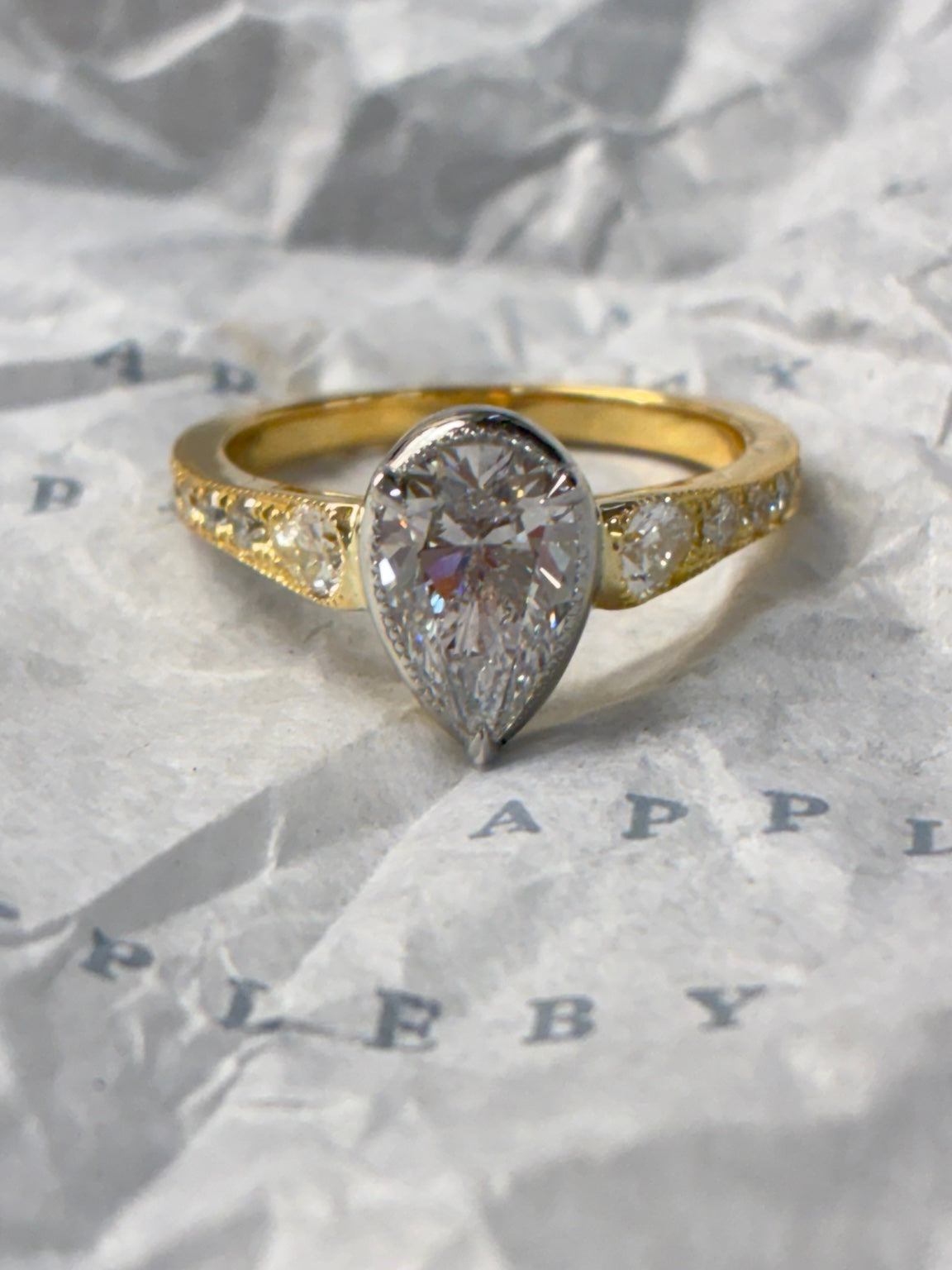 Diamond ring from Appleby Jewellers Dublin featuring a pear-shaped diamond in a sleek gold band.
