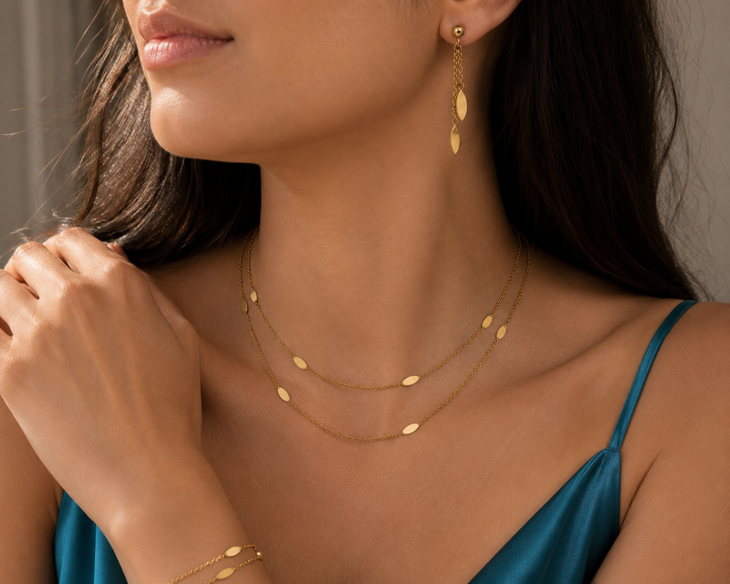 9ct gold oval drop earrings with elegant design, crafted by Appleby Jewellers Dublin, displayed against a neutral background.