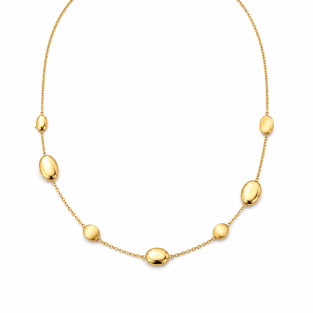 Yellow gold bead necklace with round beads, crafted by Appleby Jewellers Dublin, featuring a sleek and elegant design.