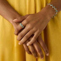 JAIPUR COLOR  18ct yellow gold band ring with topazes