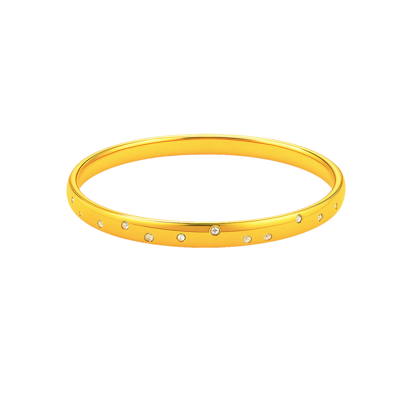 Gold bangle with small stones on a white background