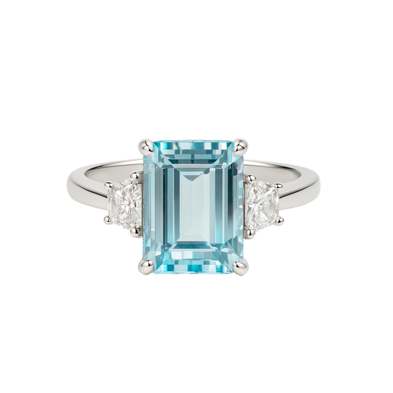 Emerald-cut aquamarine and trapeze diamond trilogy ring by Appleby Jewellers Dublin, showcasing the elegant gemstone design.