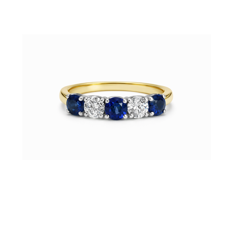 Elegant arc sapphire and diamond ring by Appleby Jewellers Dublin, showcasing a stunning gemstone design and fine craftsmanship.