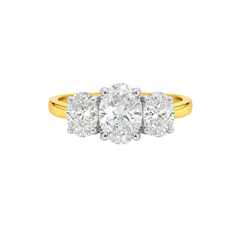 Gold ring with three diamond stones on a white background