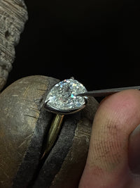 Tilted Pear Diamond Bezel Ring by Appleby Jewellers Dublin featuring a 2.51ct diamond, set in a sleek bezel setting.