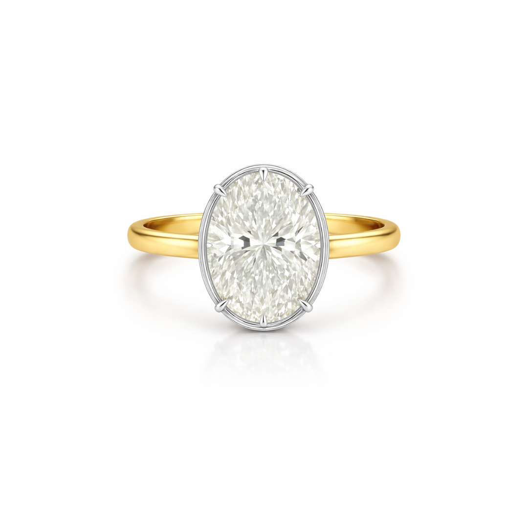 Oval diamond bezel ring from Appleby Jewellers Dublin, showcasing a 2.20ct central diamond set in a sleek gold band.