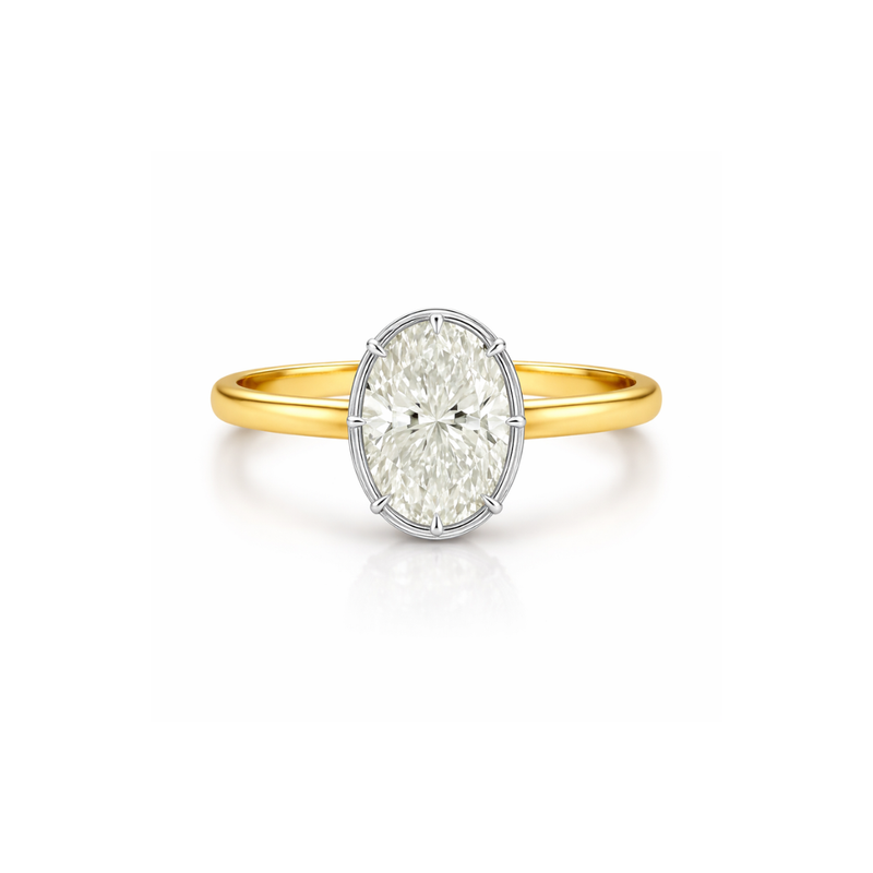 Elegant bezel oval ring featuring a central gemstone, crafted by Appleby Jewellers Dublin, showcasing fine jewelry design.