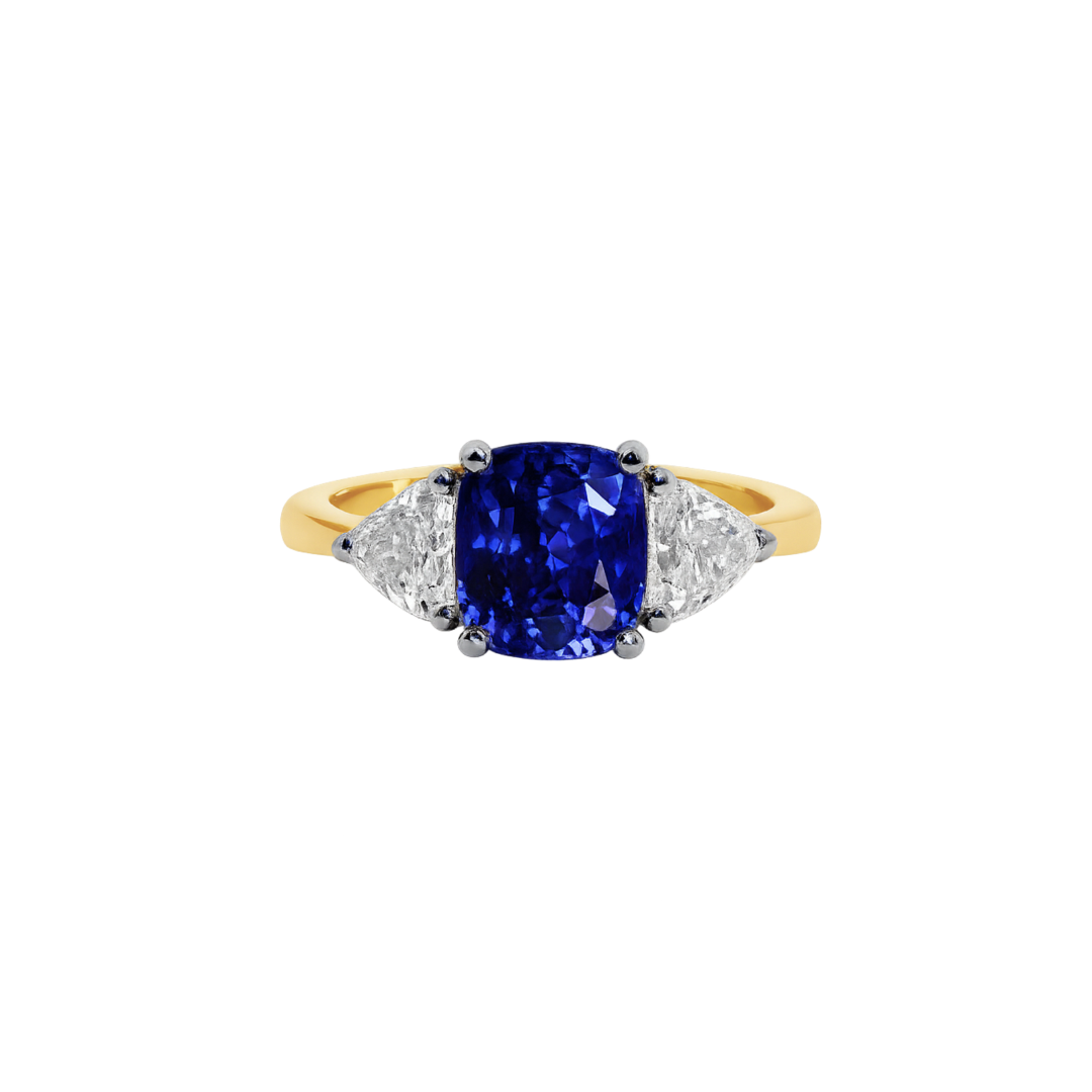 Blue sapphire cushion cut ring with a vibrant blue gemstone set in a silver band, elegant jewelry piece by Appleby Jewellers Dublin.