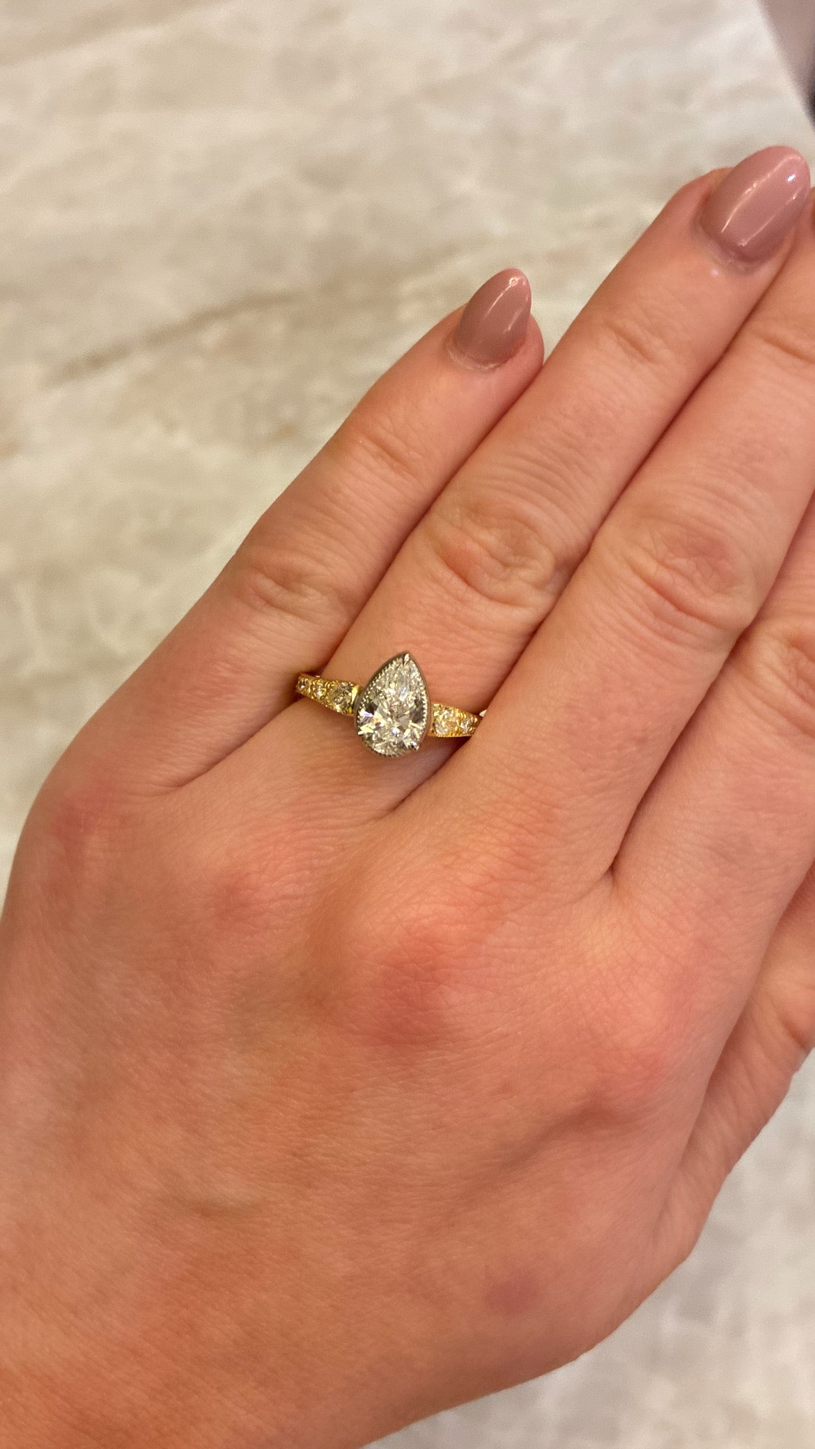 Elegant Aurelia Pear Ring by Appleby Jewellers Dublin featuring a pear-shaped diamond set in a sleek silver band.