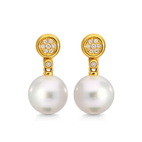 Elegant detachable pearl and diamond disc earrings by Appleby Jewellers Dublin, showcasing sparkling gemstones and stylish design.