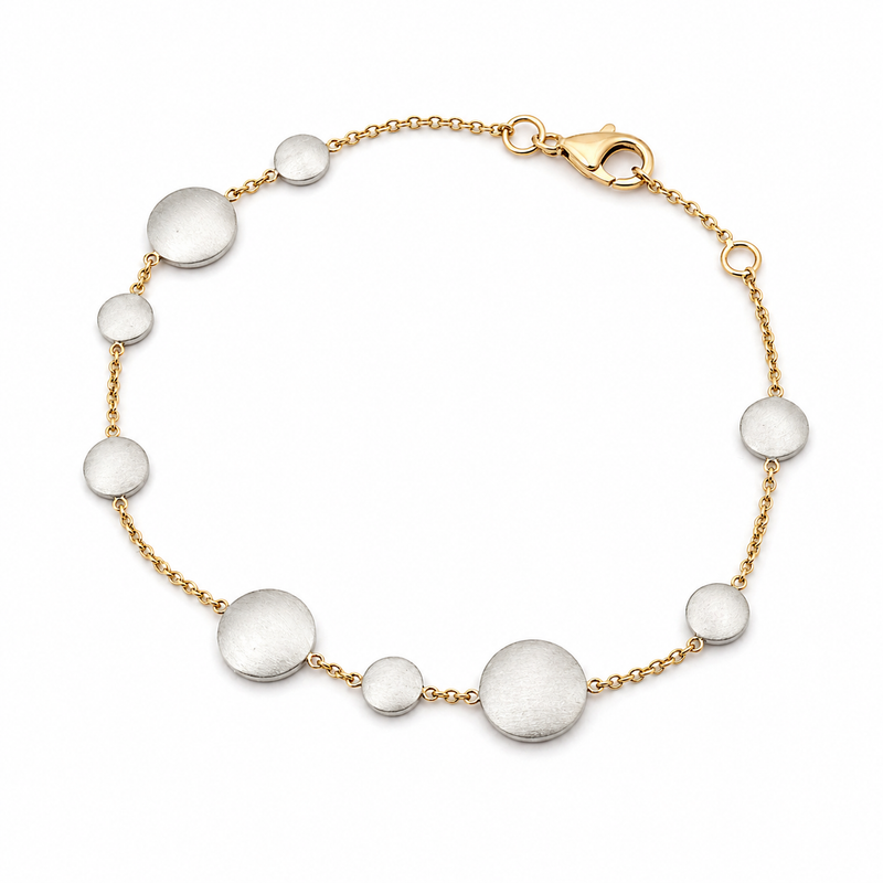Silver disc bracelet by Appleby Jewellers Dublin featuring round, polished charms on a delicate chain.
