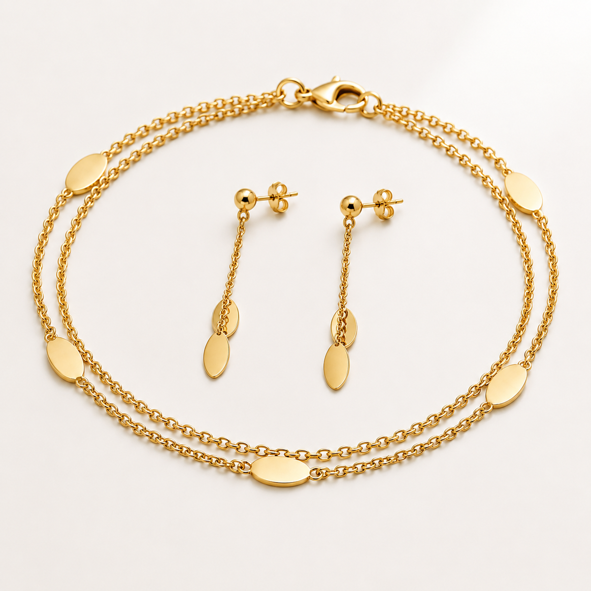 Double strand bracelet and matching earrings set by Appleby Jewellers Dublin, featuring elegant silver jewelry with detailed design.