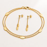 Double strand bracelet and matching earrings set by Appleby Jewellers Dublin, featuring elegant silver jewelry with detailed design.