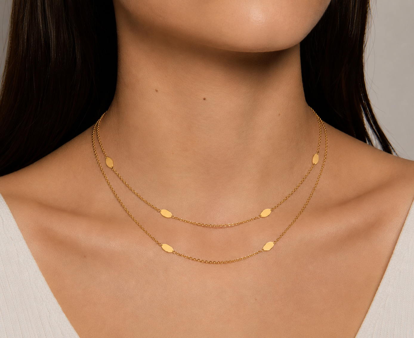 Double strand necklace, bracelet, and earrings set by Appleby Jewellers Dublin, featuring elegant jewelry with intricate design.