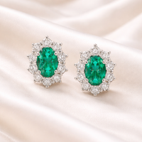 Elegant emerald and diamond earrings featuring sparkling stones, crafted by Appleby Jewellers Dublin.
