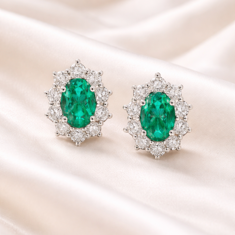 Elegant emerald and diamond earrings by Appleby Jewellers Dublin, showcasing vibrant green gemstones and sparkling accents.