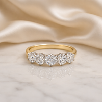 Elegant five-stone diamond ring with 3.64ct diamonds from Appleby Jewellers Dublin, displayed on a marble surface.