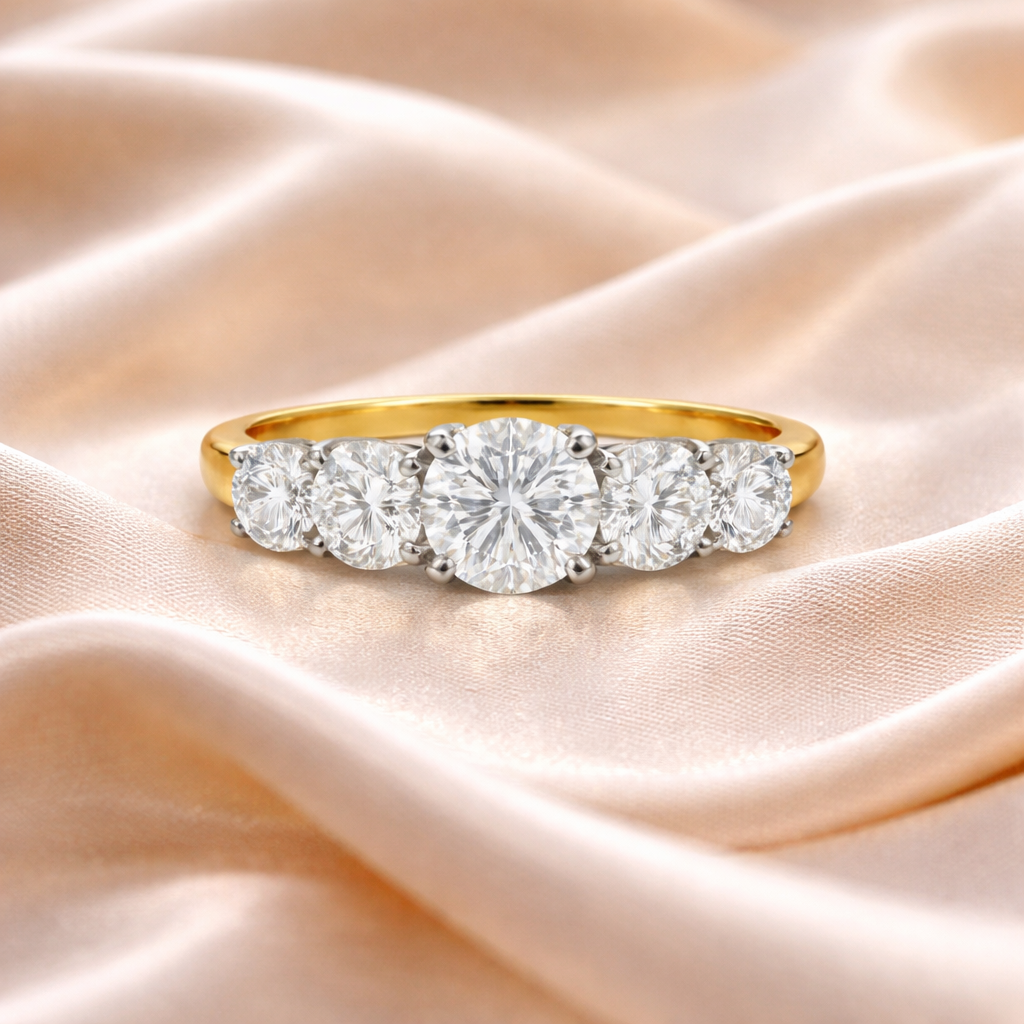 Elegant five-stone diamond ring by Appleby Jewellers Dublin displayed on silk, showcasing the sparkling diamonds and intricate design.