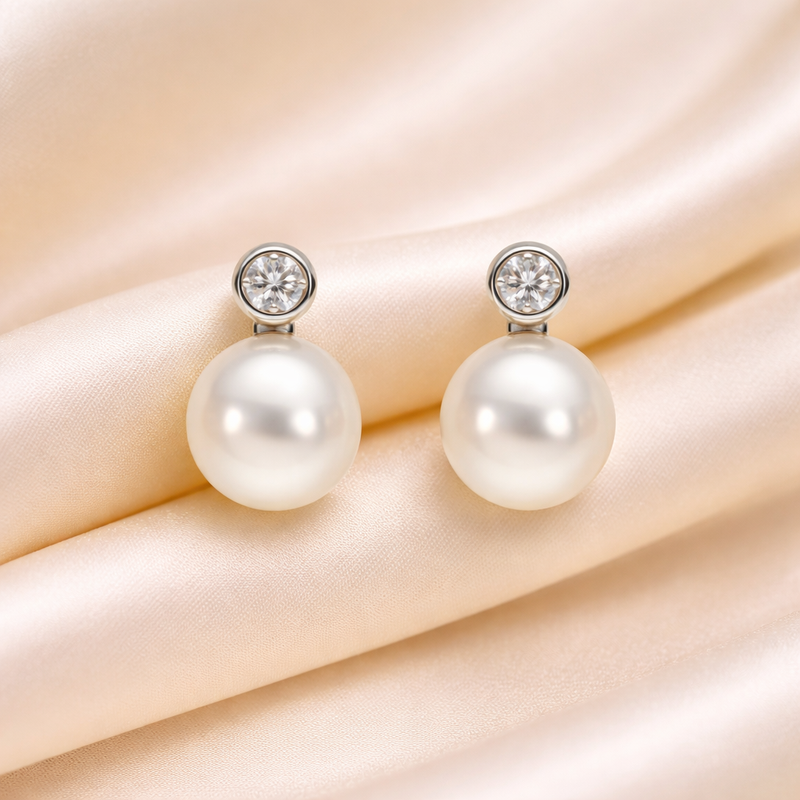 Elegant pearl and diamond stud earrings by Appleby Jewellers Dublin, showcasing classic design and sparkling gemstones.