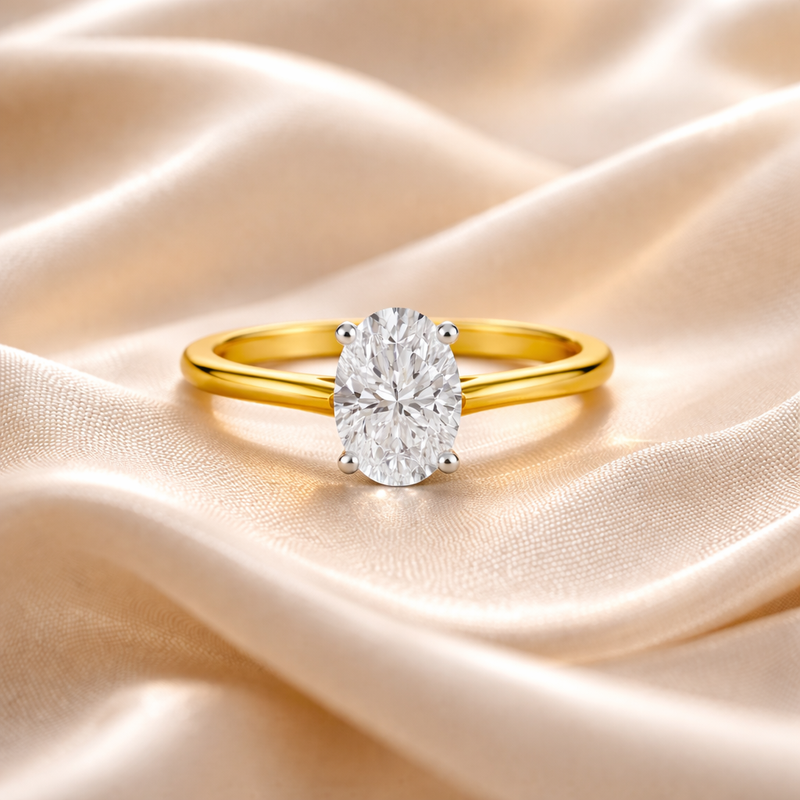 Elegant solitaire J'adore 1.06ct oval diamond engagement ring displayed on champagne silk, crafted by Appleby Jewellers Dublin.