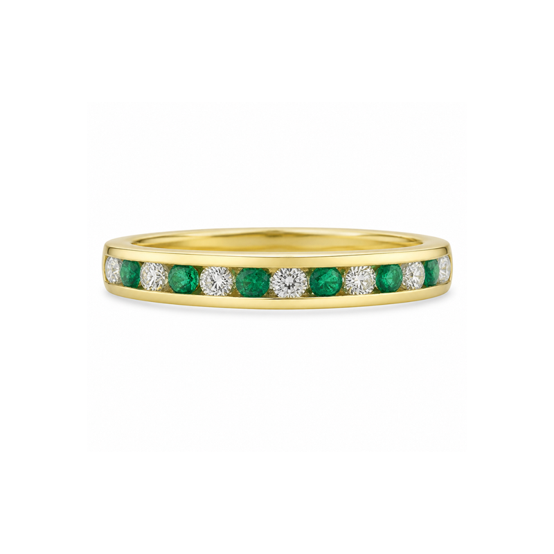 Emerald and diamond eternity ring by Appleby Jewellers Dublin featuring a continuous band of emeralds and sparkling diamonds.