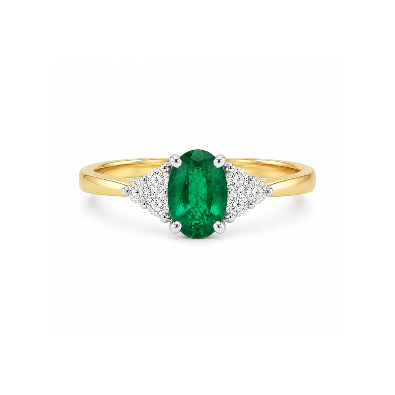 Emerald and diamond three-stone ring by Appleby Jewellers Dublin featuring a central emerald with side diamonds.