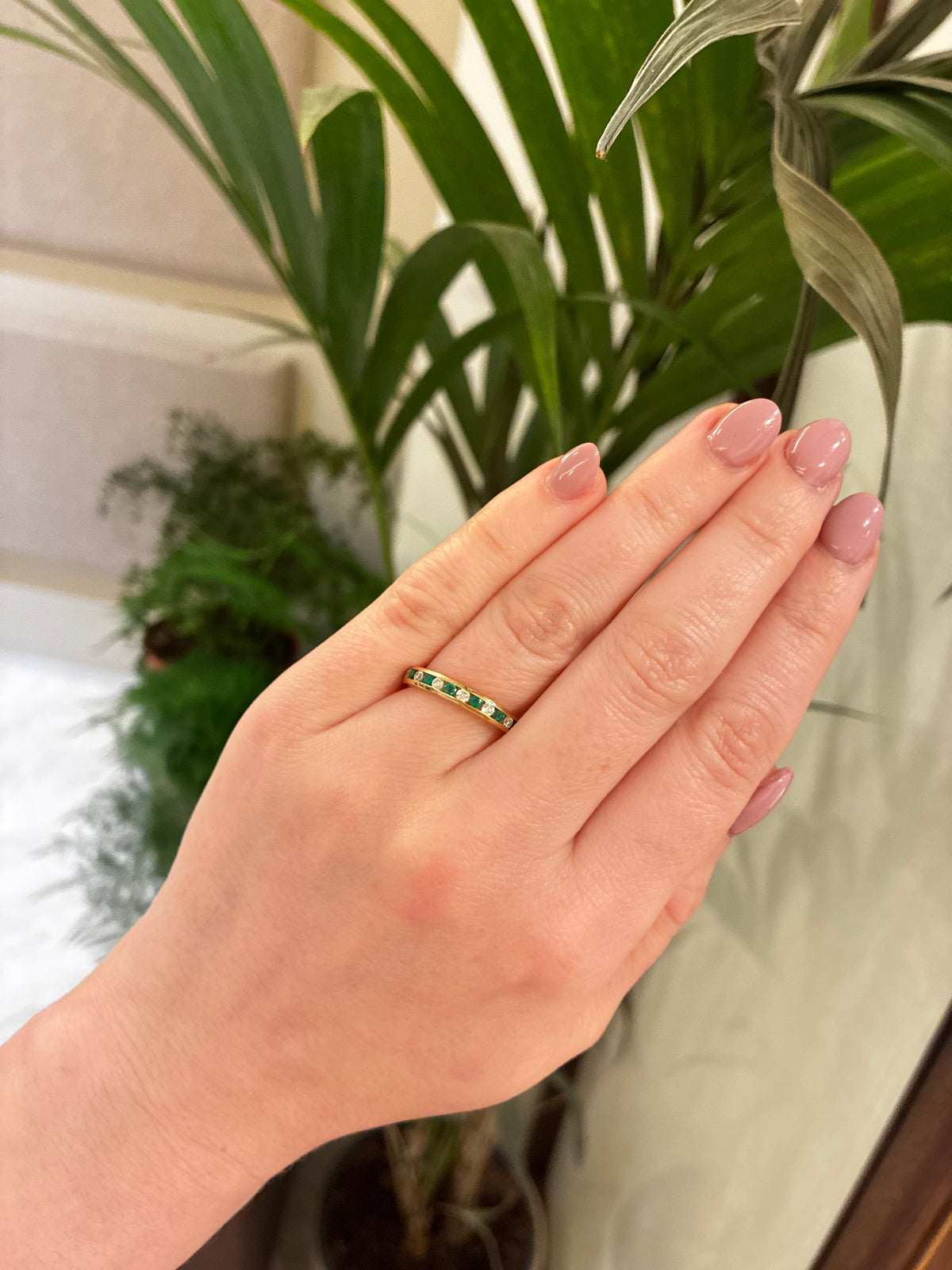 Elegant emerald and diamond eternity ring by Appleby Jewellers Dublin, showcasing a continuous band of sparkling gemstones.
