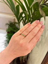 Elegant emerald and diamond eternity ring by Appleby Jewellers Dublin, showcasing a continuous band of sparkling gemstones.