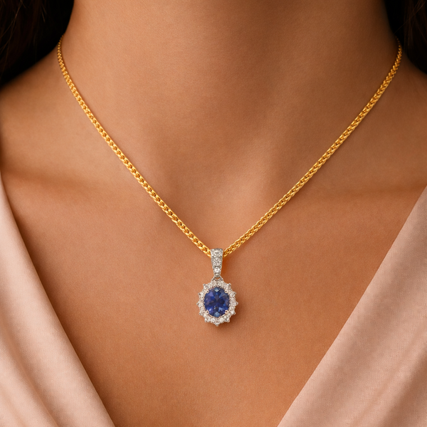 Elegant blue sapphire and diamond halo pendant necklace by Appleby Jewellers Dublin, featuring a sparkling gemstone design.