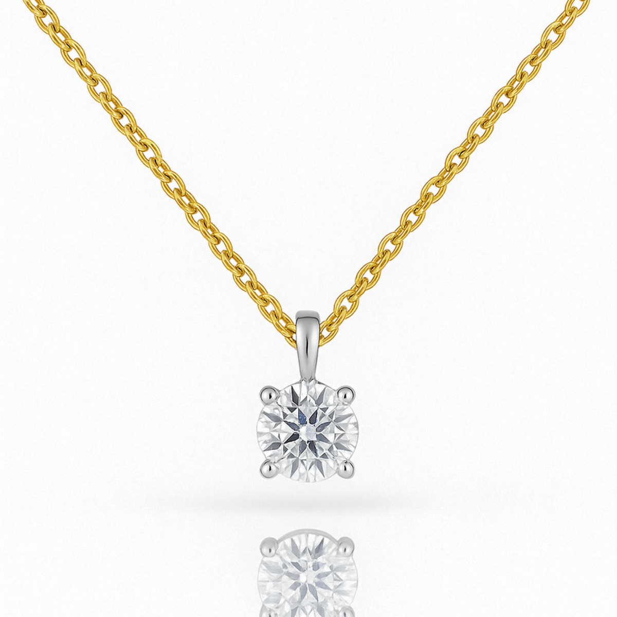 18ct white gold solitaire diamond pendant on yellow gold chain, elegant jewelry piece with a sparkling diamond from Appleby Jewellers Dublin.