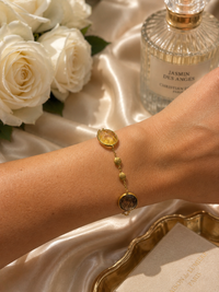 14ct gold quartz bracelet featuring a sleek design with a gold band and a polished quartz stone, styled by Appleby Jewellers Dublin.