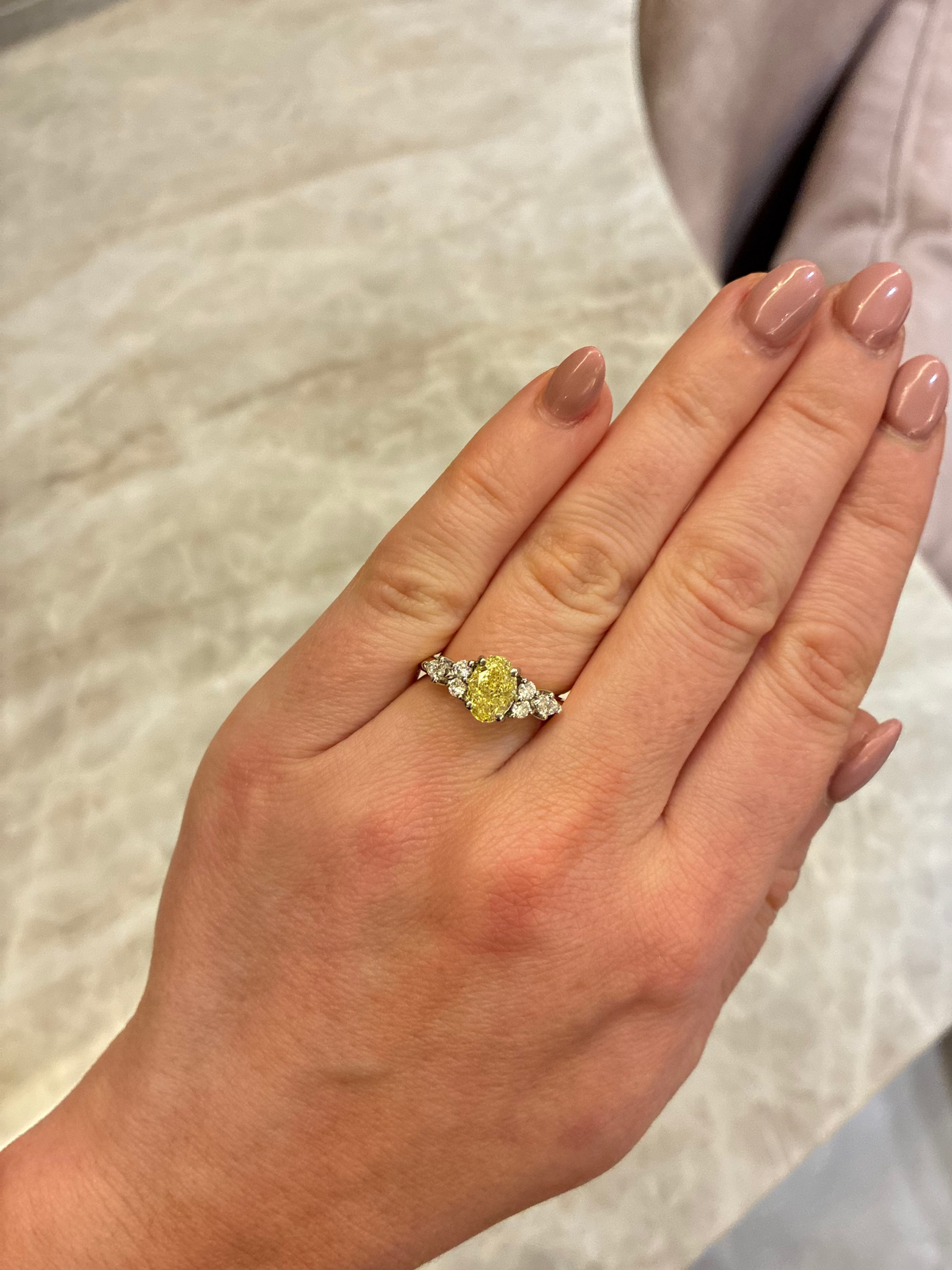 Yellow diamond ring from The Aura collection by Appleby Jewellers Dublin, showcasing a sparkling yellow diamond set in a sleek band.