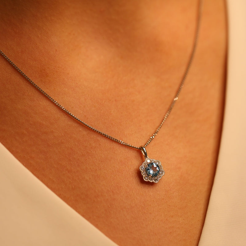 Blue Topaz & Diamond Flower Pendant