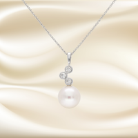 Elegant pearl and diamond trilogy necklace by Appleby Jewellers Dublin, featuring a timeless design with sparkling gemstones.