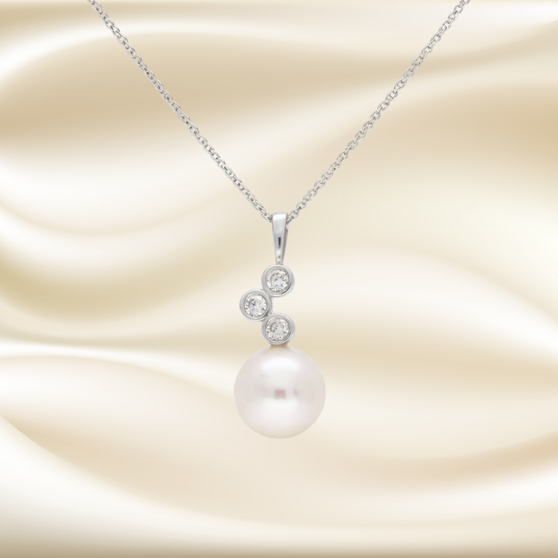 Elegant pearl and diamond trilogy necklace by Appleby Jewellers Dublin, featuring a timeless design with sparkling gemstones.