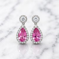 Pink sapphire and diamond drop earrings by Appleby Jewellers Dublin, showcasing elegant gemstone and sparkle design