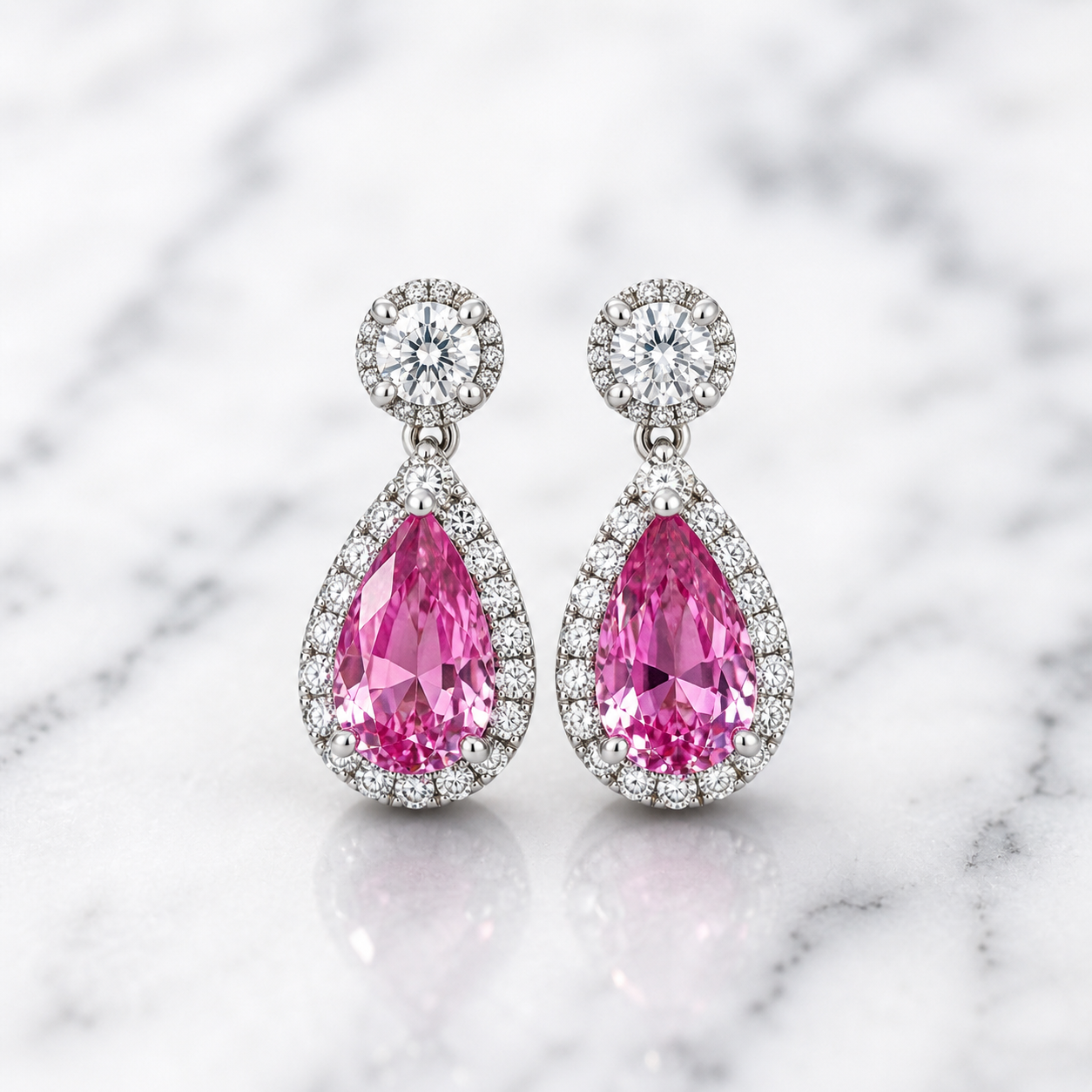 Pink sapphire and diamond drop earrings by Appleby Jewellers Dublin, showcasing elegant gemstone and sparkle design