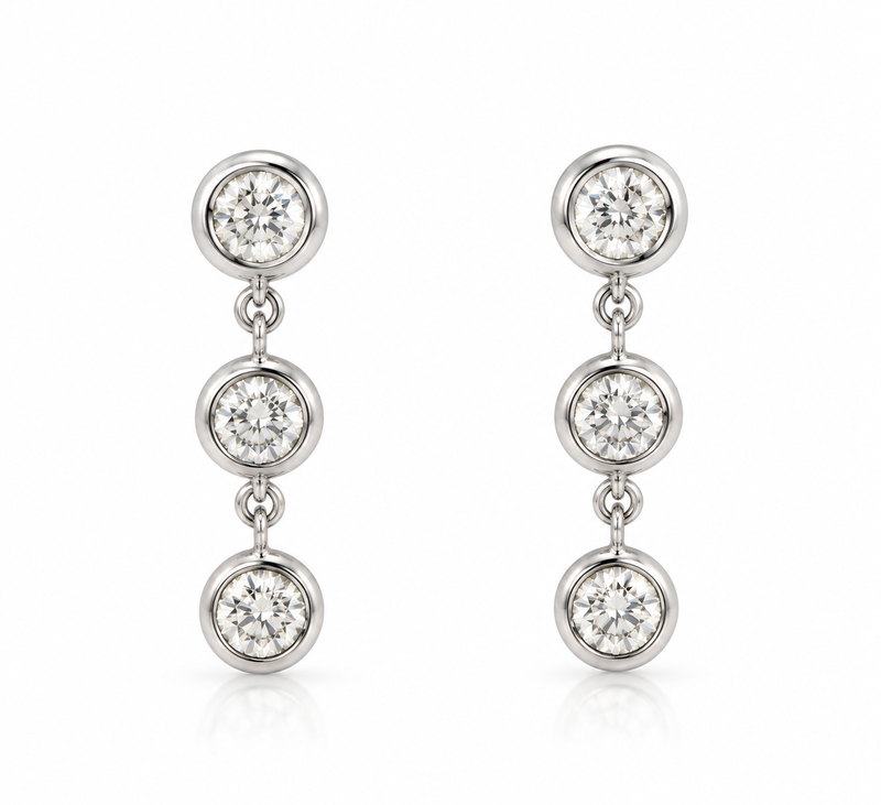 Silver drop earrings with three sparkling diamonds from Appleby Jewellers Dublin, elegant and symmetrical jewelry design.
