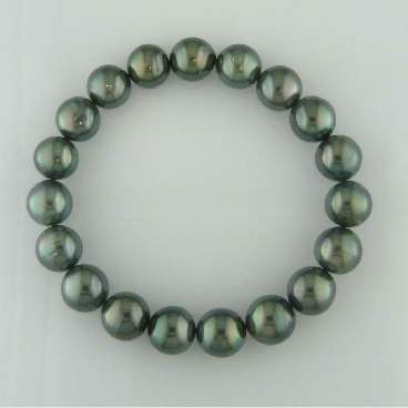 Pearl bracelet with greenish-black pearls on a white background
