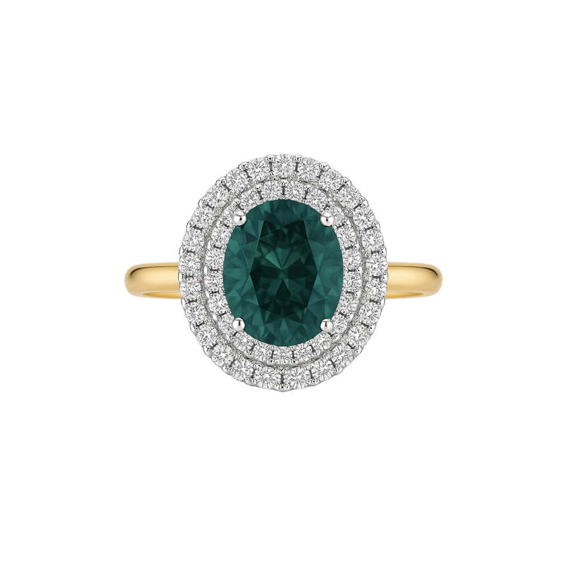 Ring with green gemstone and diamond halo on a white background
