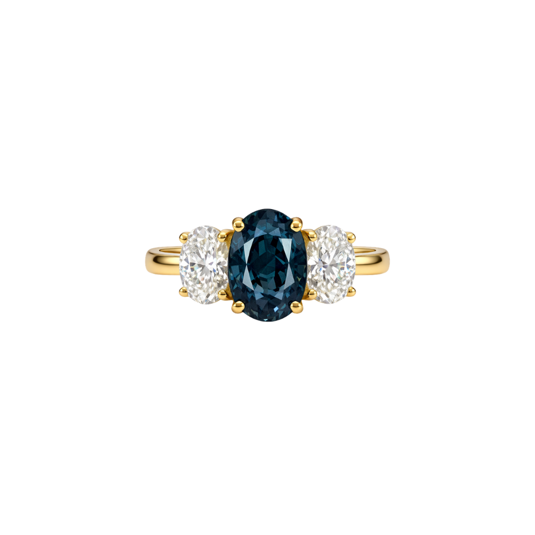 Teal sapphire and diamond trilogy ring featuring three stones set in a sleek band, crafted by Appleby Jewellers Dublin.