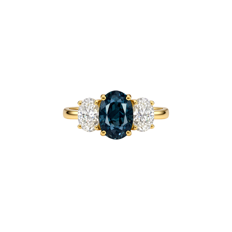 Teal sapphire and diamond trilogy ring by Appleby Jewellers Dublin featuring a 3.95ct teal sapphire centerpiece with diamond accents.