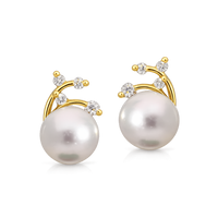 Pearl and diamond stud earrings from Appleby Jewellers Dublin featuring elegant pearl centerpiece with sparkling diamonds.