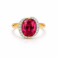 Gold ring with a large pink gemstone and diamond accents on a white background