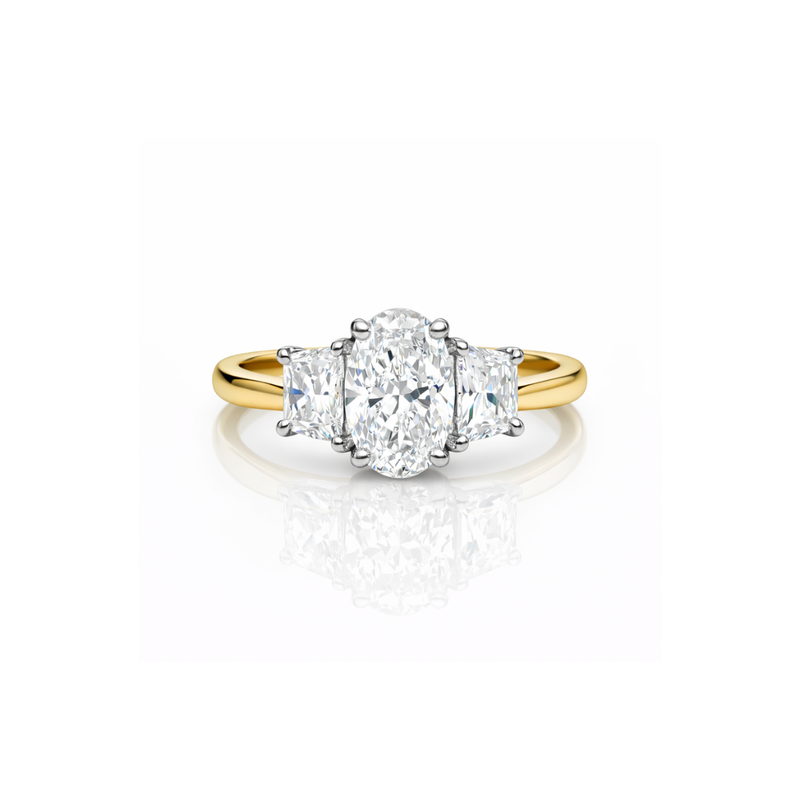 Elegant diamond ring featuring oval and trapezoid shapes by Appleby Jewellers Dublin, showcasing intricate design and sparkling gemstones.