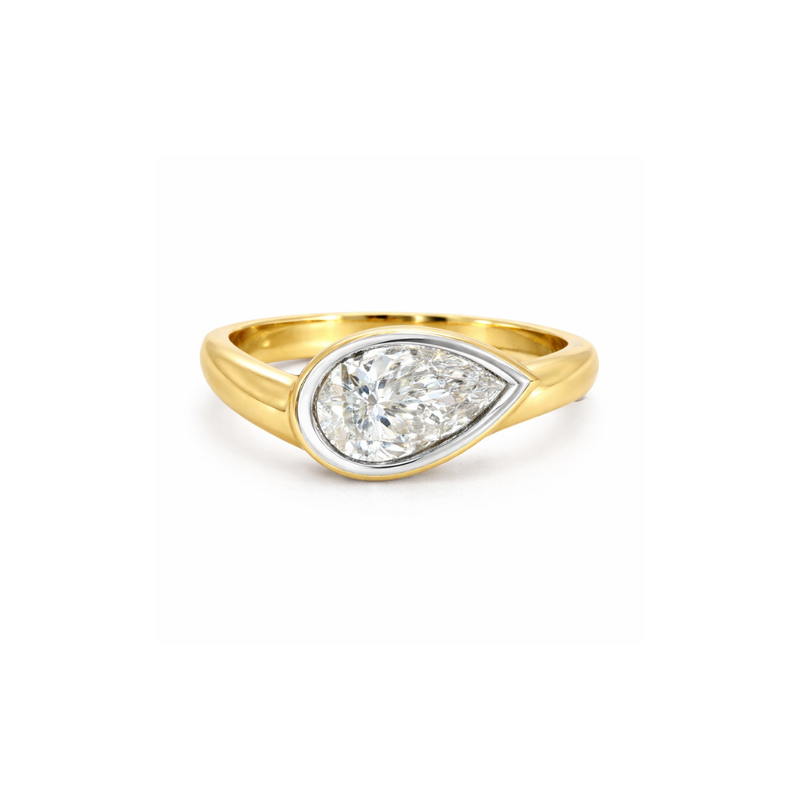 Elegant diamond bezel ring from Appleby Jewellers Dublin featuring a sleek design and sparkling diamonds on a polished band.